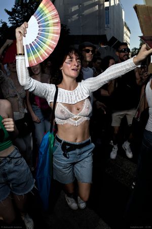 Portrait of a dancing girl with a hand fan